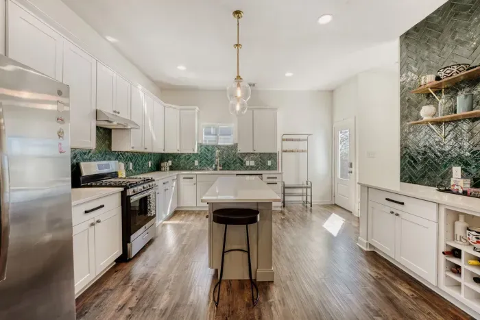 Fully equipped kitchen with spacious counters and a clean, open layout.