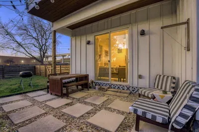 Comfortable seating and warm lighting for relaxing outdoors.