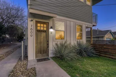 Contemporary curb appeal with private entry and welcoming lighting.