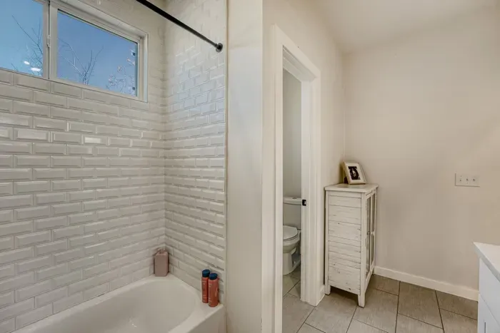 Clean, modern shower with sleek tile design.