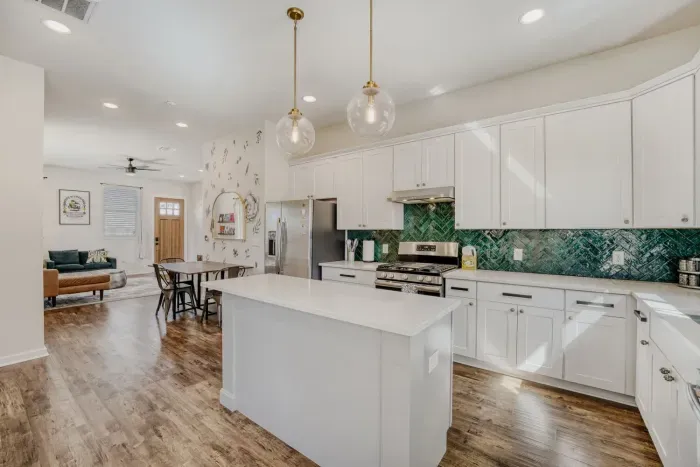 Fully equipped kitchen featuring a large island and updated finishes.