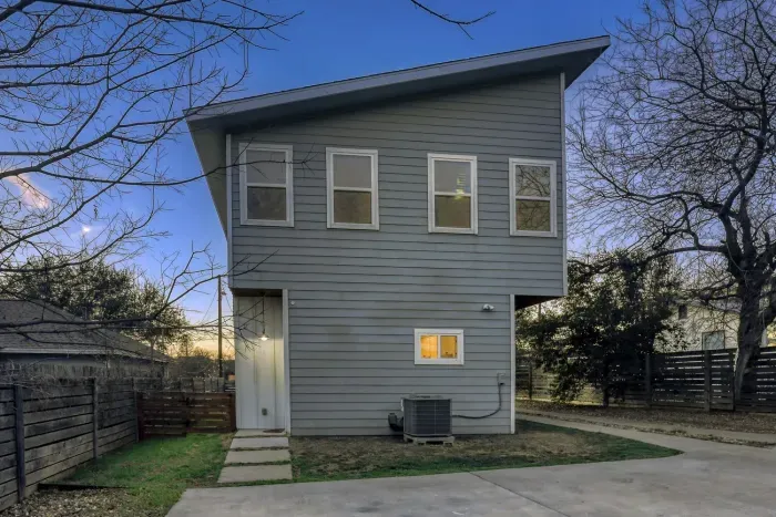 Private backyard access and contemporary exterior design.