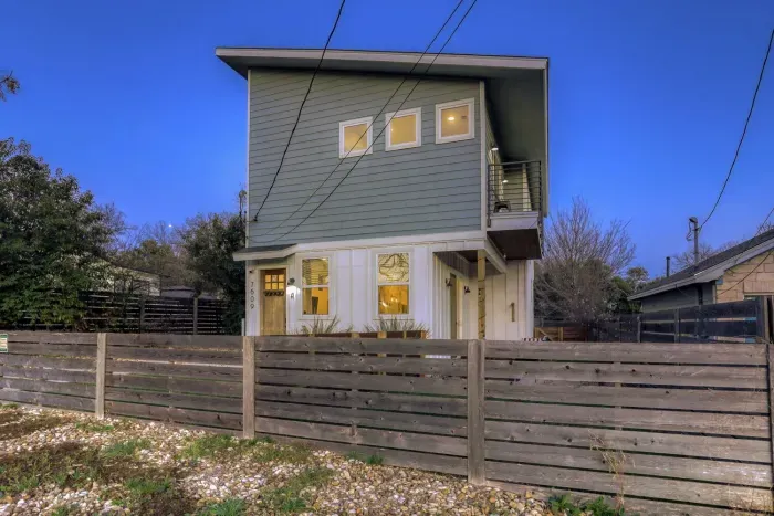 Soft exterior lighting creates a welcoming nighttime atmosphere.