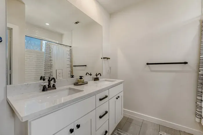 Bright bathroom with spacious counter space and updated fixtures.