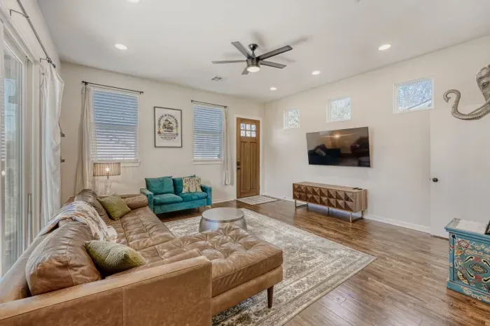 Spacious living area with modern furnishings and plenty of natural light.