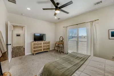 Comfortable primary suite with soft lighting and a relaxing atmosphere.