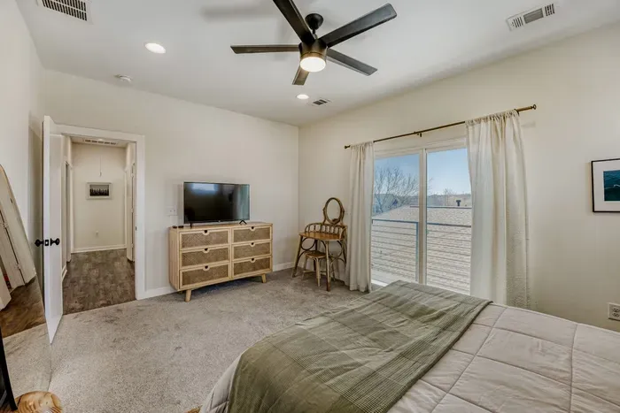 Comfortable primary suite with soft lighting and a relaxing atmosphere.