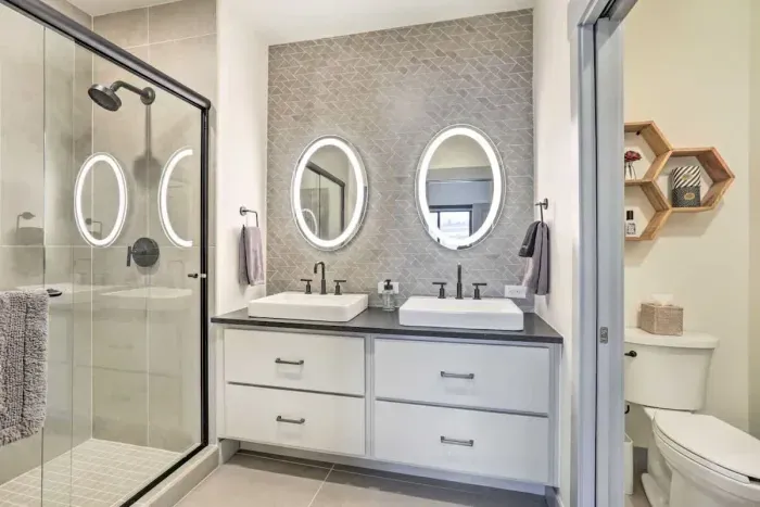 Bright and airy bathroom with plenty of counter space and stylish decor.
