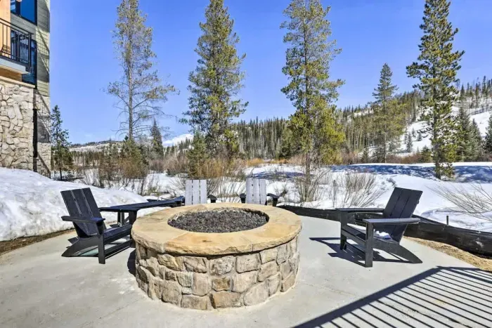 Oasis featuring comfy seating, and a fire pit for cozy evenings.