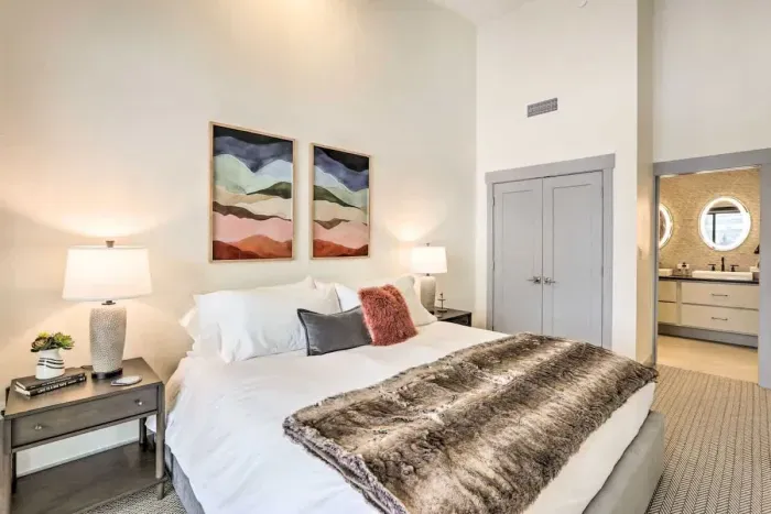 Peaceful bedroom with a plush bed and soft linens for a restful night’s sleep.