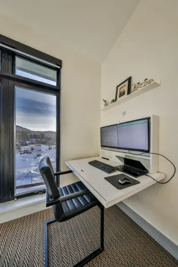 Floating desk workstation with mountain views for remote work.
