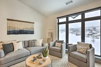 Spacious and bright living room with large windows and serene views.