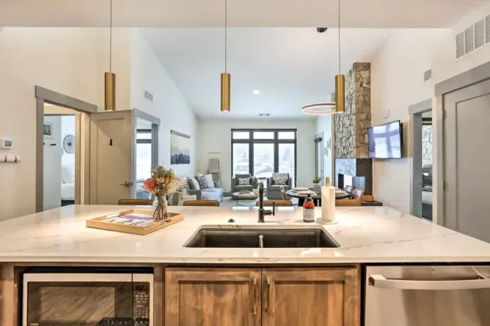 Warm and inviting kitchen with beautiful countertops and all the comforts of home.