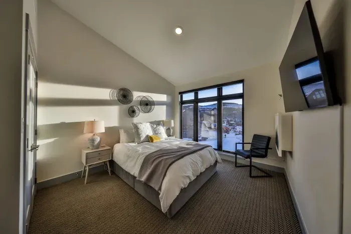 Bedroom with natural light and dedicated floating office table.