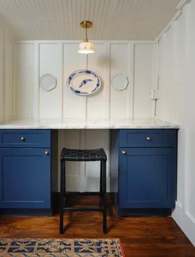 Built-in desk workspace with custom cabinetry and classic design.