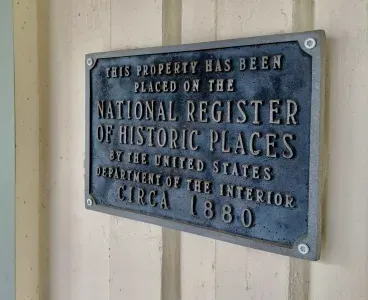 Historic plaque recognizing the home’s heritage.