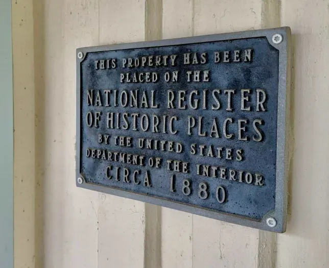 Historic plaque recognizing the home’s heritage.