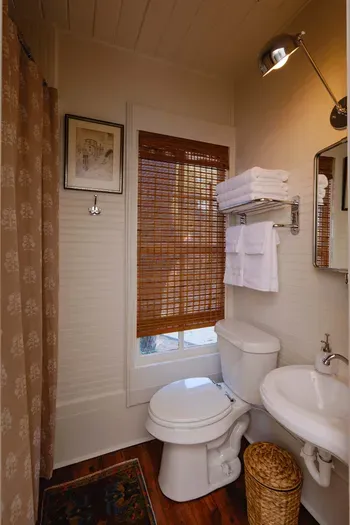 Full bathroom with shower and classic finishes