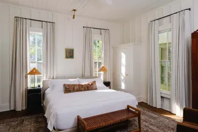 Comfortable primary bedroom with natural light