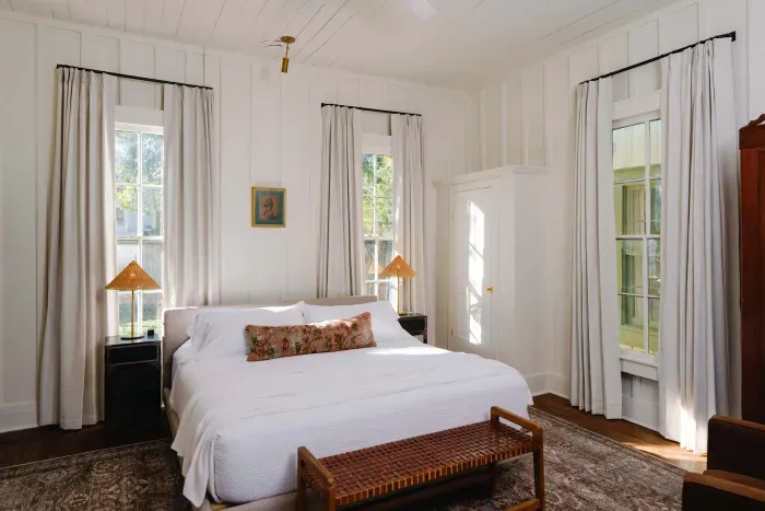 Comfortable primary bedroom with natural light