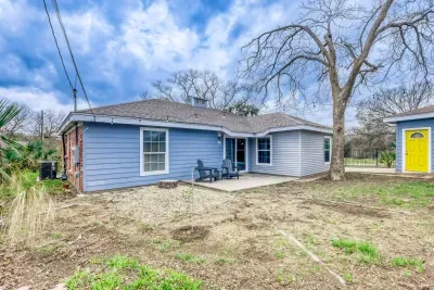Spacious backyard with patio seating and plenty of room to unwind