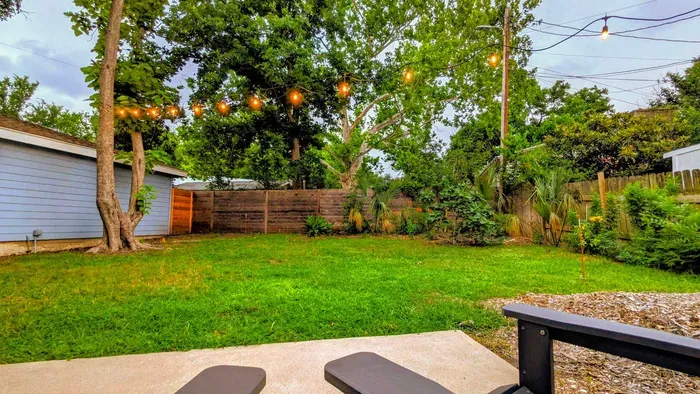 Quiet backyard retreat with outdoor lounge chairs and a peaceful neighborhood setting