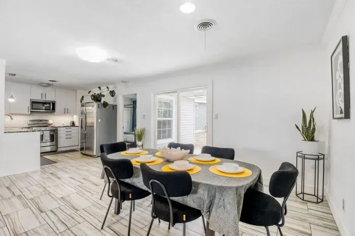Bright dining area connecting seamlessly to the kitchen and backyard patio