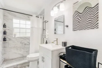 Clean and simple bathroom with fresh finishes and bright natural light.