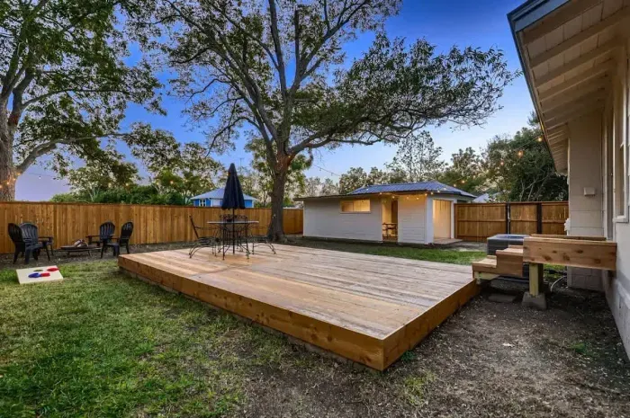 Backyard with yard games and a fire pit