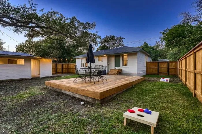 Well-maintained backyard with a variety of trees and shrubs for a natural, private setting.