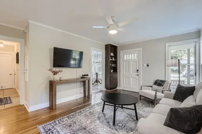 Cozy living room with plush seating and a large TV for movie nights or relaxing afternoons.