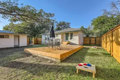 Backyard with yard games and a fire pit