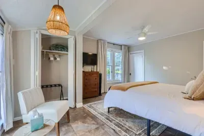 Bright and cheerful bedroom with a large bed and plenty of natural light.