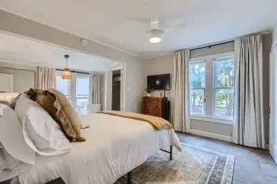 Modern bedroom with minimalist design and high-quality bedding.