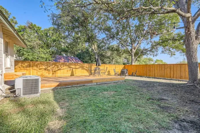 Backyard with yard games and a fire pit