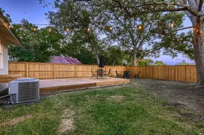 Backyard with yard games and a fire pit