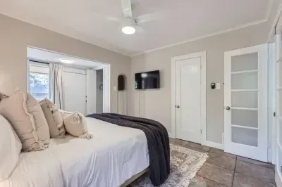 Functional and stylish bedroom with a desk for remote work or study.