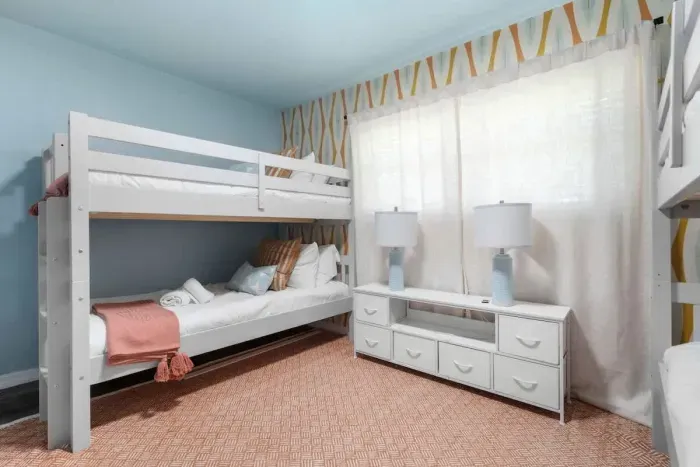 Designed for comfort, this room offers plenty of cozy beds to unwind.