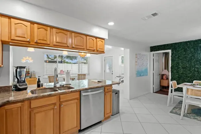 Gorgeous white kitchen with subway tile backsplash and stylish accents to inspire your meals.