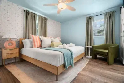Bright and cheerful bedroom with a large bed and plenty of natural light.
