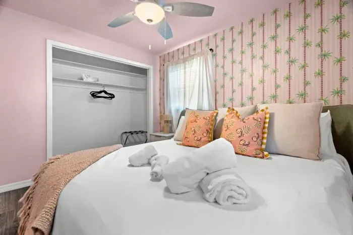 Modern bedroom with minimalist design and high-quality bedding.