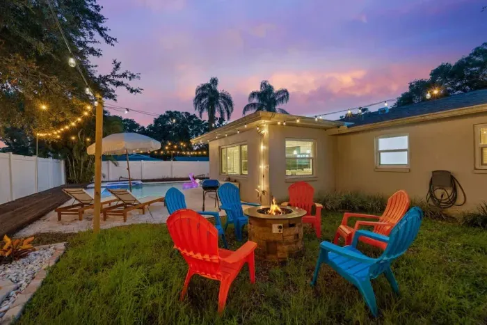 Backyard with a cozy fire pit, ideal for roasting marshmallows and enjoying the cool evening air.