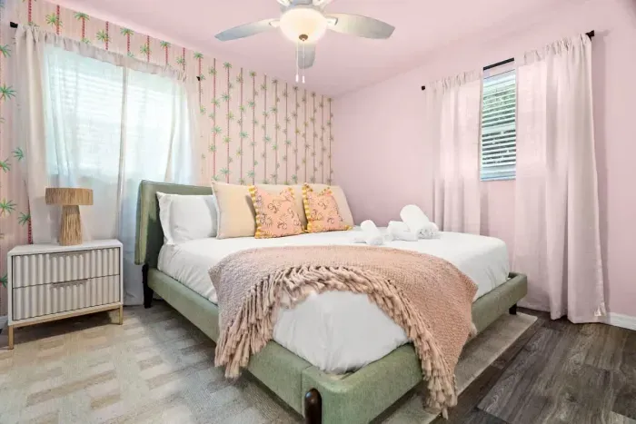 Peaceful bedroom with a plush king-sized bed and soft linens for a restful night’s sleep.