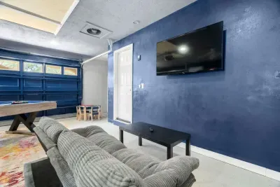 Equipped with a large TV, cozy seating, and space for everyone.