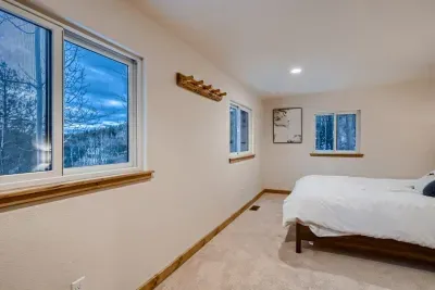 Peaceful bedroom with a plush queen-sized bed and soft linens for a restful night’s sleep.