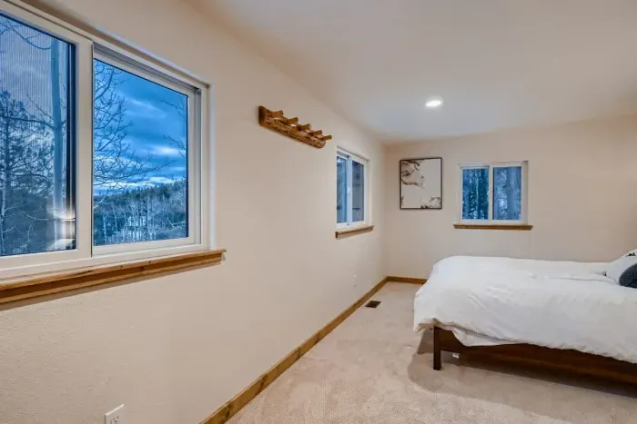 Peaceful bedroom with a plush queen-sized bed and soft linens for a restful night’s sleep.