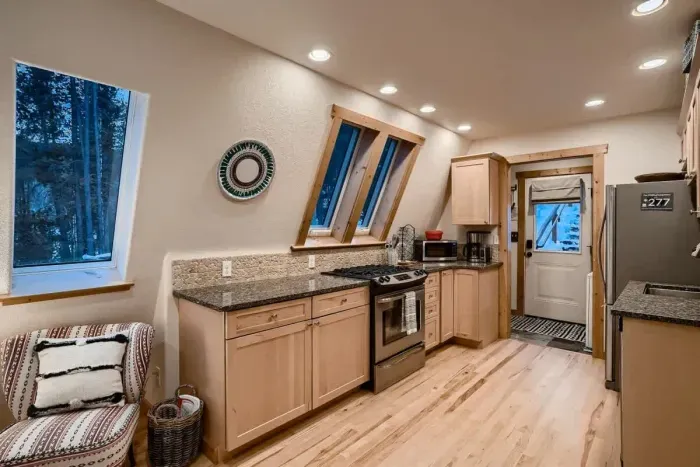 Enjoy the spacious kitchen, seamlessly open to the living room, creating a perfect flow for entertaining and everyday living. Modern appliances, ample counter space, and a comfortable layout make this area ideal for cooking, dining, and relaxing with