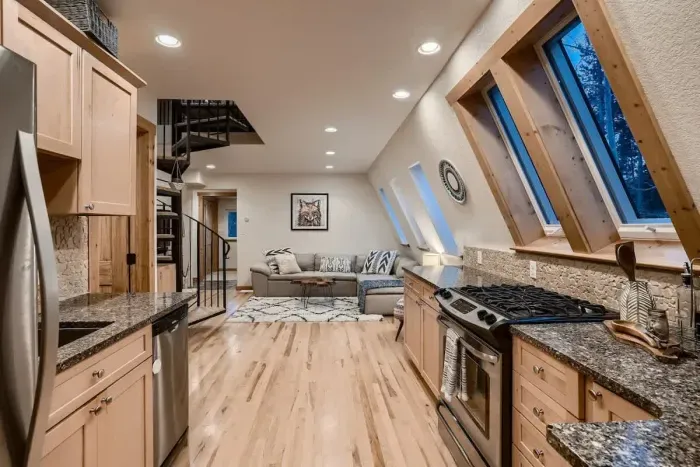 Experience the open main floor, designed to create a seamless flow between living, dining, and kitchen areas. The spacious layout is perfect for both entertaining and everyday living, offering a bright and airy atmosphere.