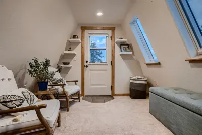 Enjoy the spacious upstairs loft, featuring a comfortable couch bed for additional sleeping space. This versatile area offers a cozy retreat with plenty of room for relaxation, perfect for guests or extra lounging.