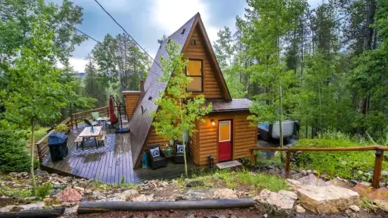 1. Escape to this cozy cabin nestled in the woods, where tranquility meets nature. Surrounded by towering trees, this serene retreat offers the perfect blend of comfort and seclusion. Whether you're relaxing by the fire or exploring nearby trails.